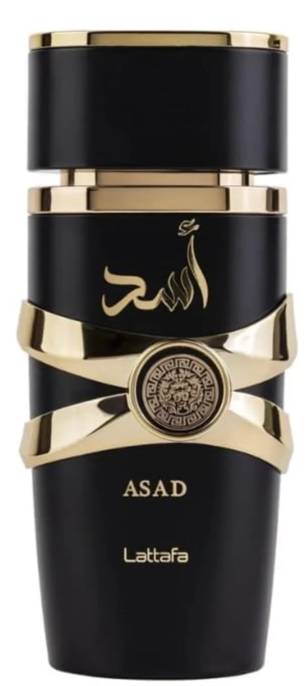 Black and gold fragrance bottle labeled Asad by Lattafa with Arabic calligraphy and decorative gold accents