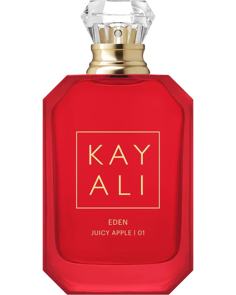 Red Kayali Eden Juicy Apple fragrance bottle with gold trim and crystal stopper